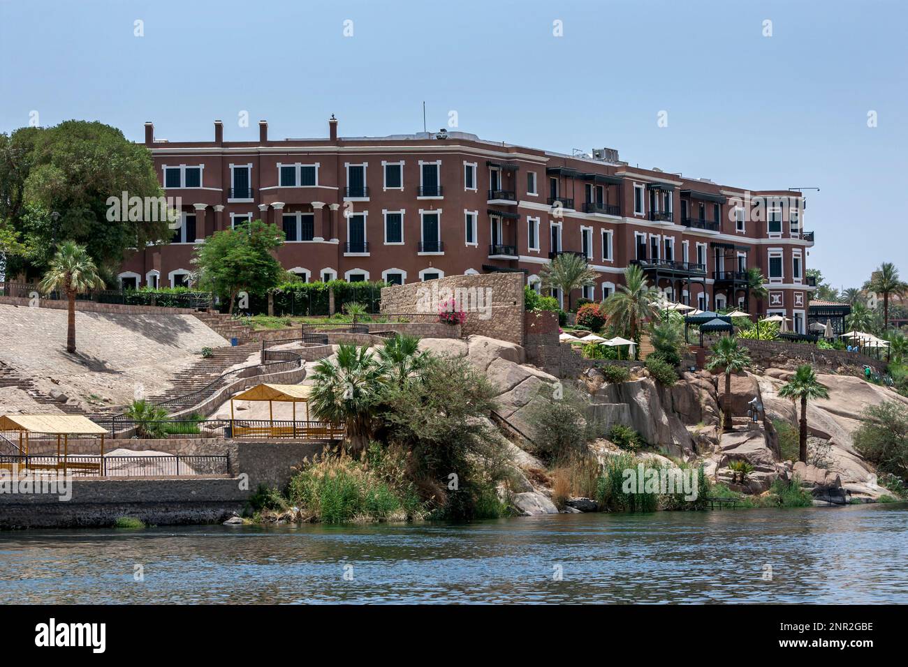 The famous Old Cataract Hotel which overlooks the River Nile at Aswan in Egypt. It was built in 1899 by Thomas Cook. Stock Photo