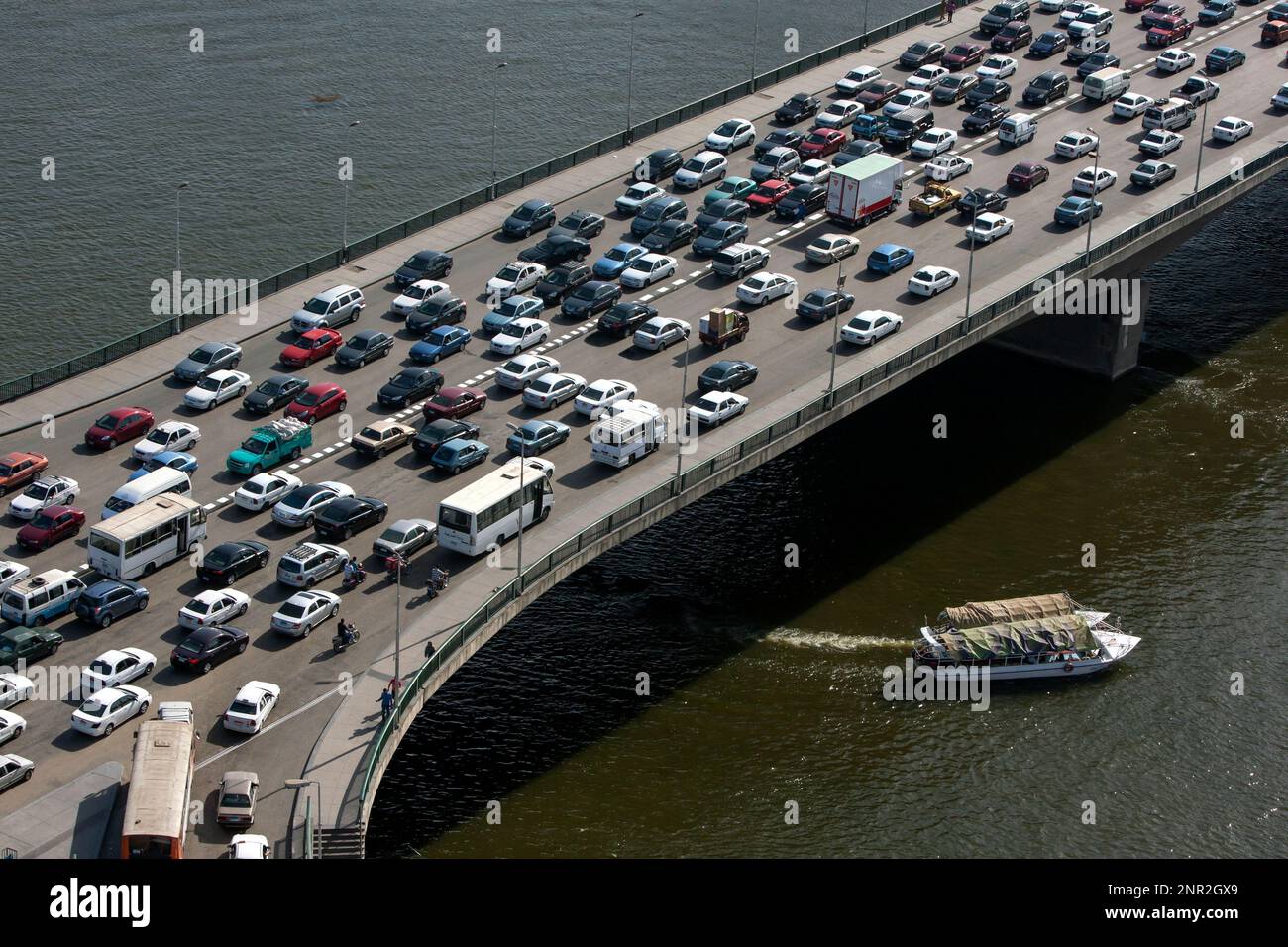 Afternoon peak hour traffic gridlock over the 6th October Bridge which crosses the River Nile at Cairo in Egypt. Stock Photo