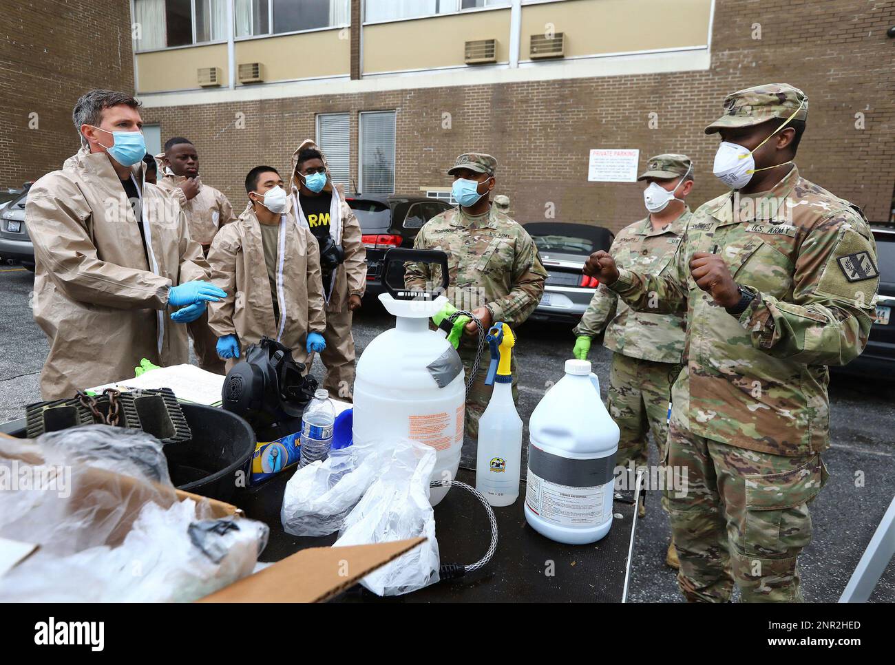 Army National Guard Spc Garrett Able (far left) prepares to