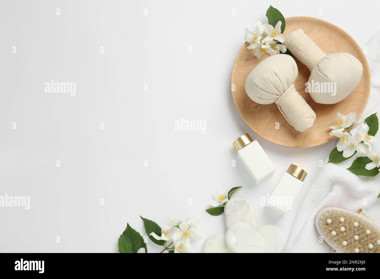 Flat lay composition with spa stones and jasmine flowers on white ...