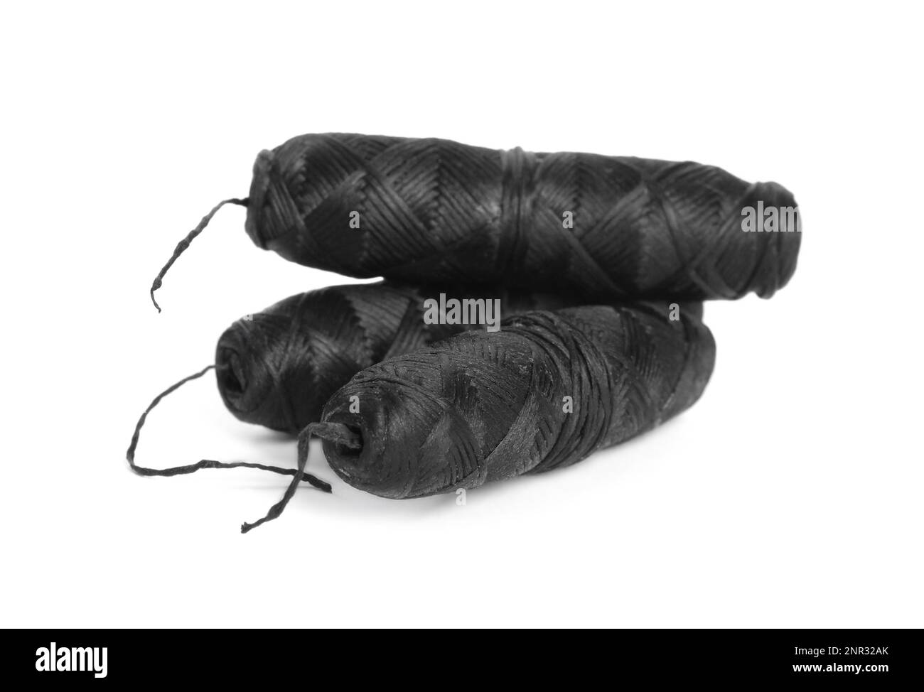 Rolls of natural organic dental floss on white background Stock Photo