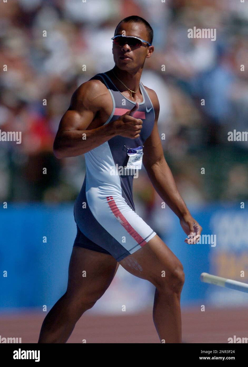 Decathlon winner Bryan Clay celebrates a clearance of 168 3/4 in the