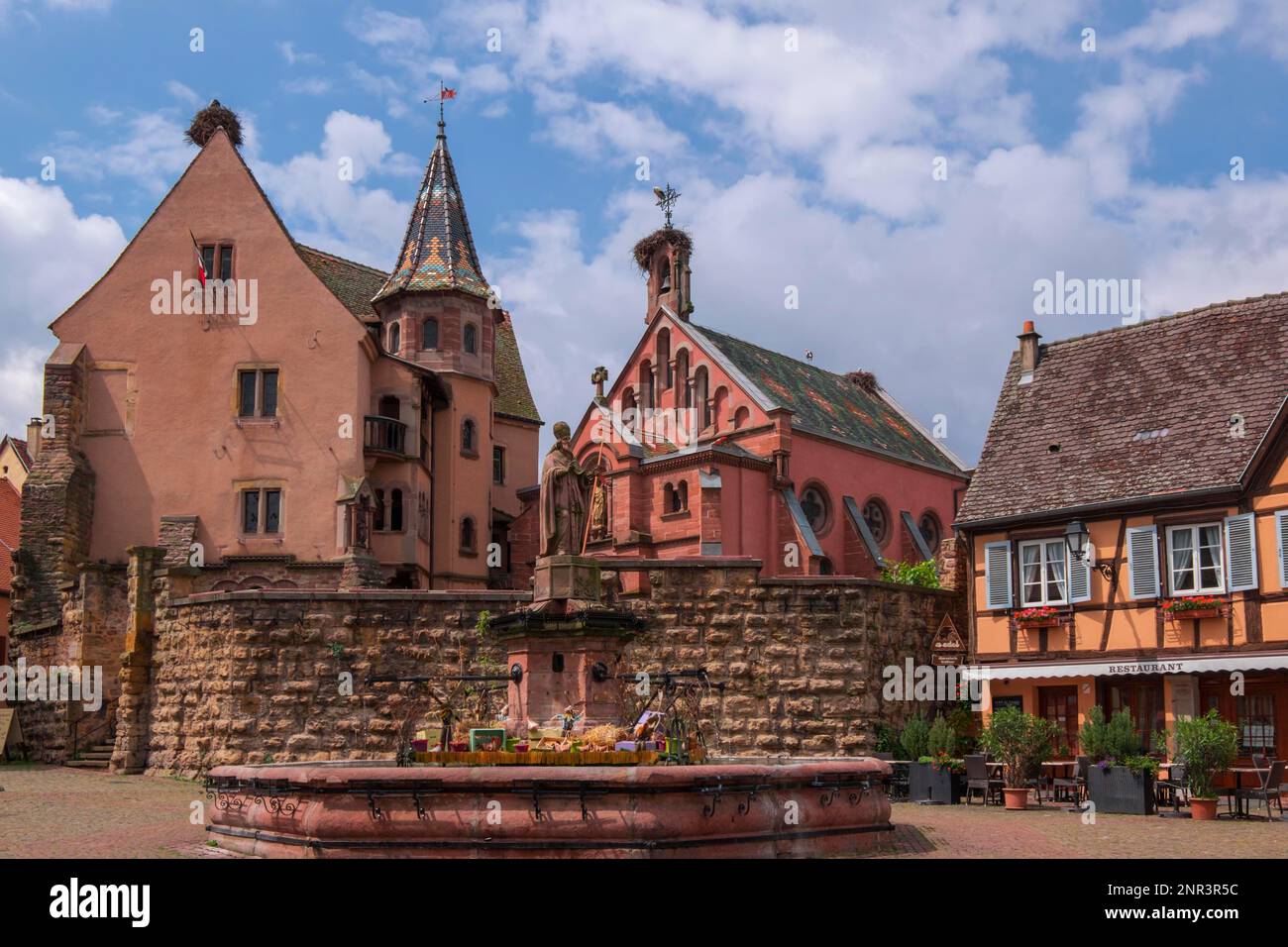 Castle and St. Leo Chapel at Place de Chateau St. Leon, Eguisheim, Alsace, France Stock Photo