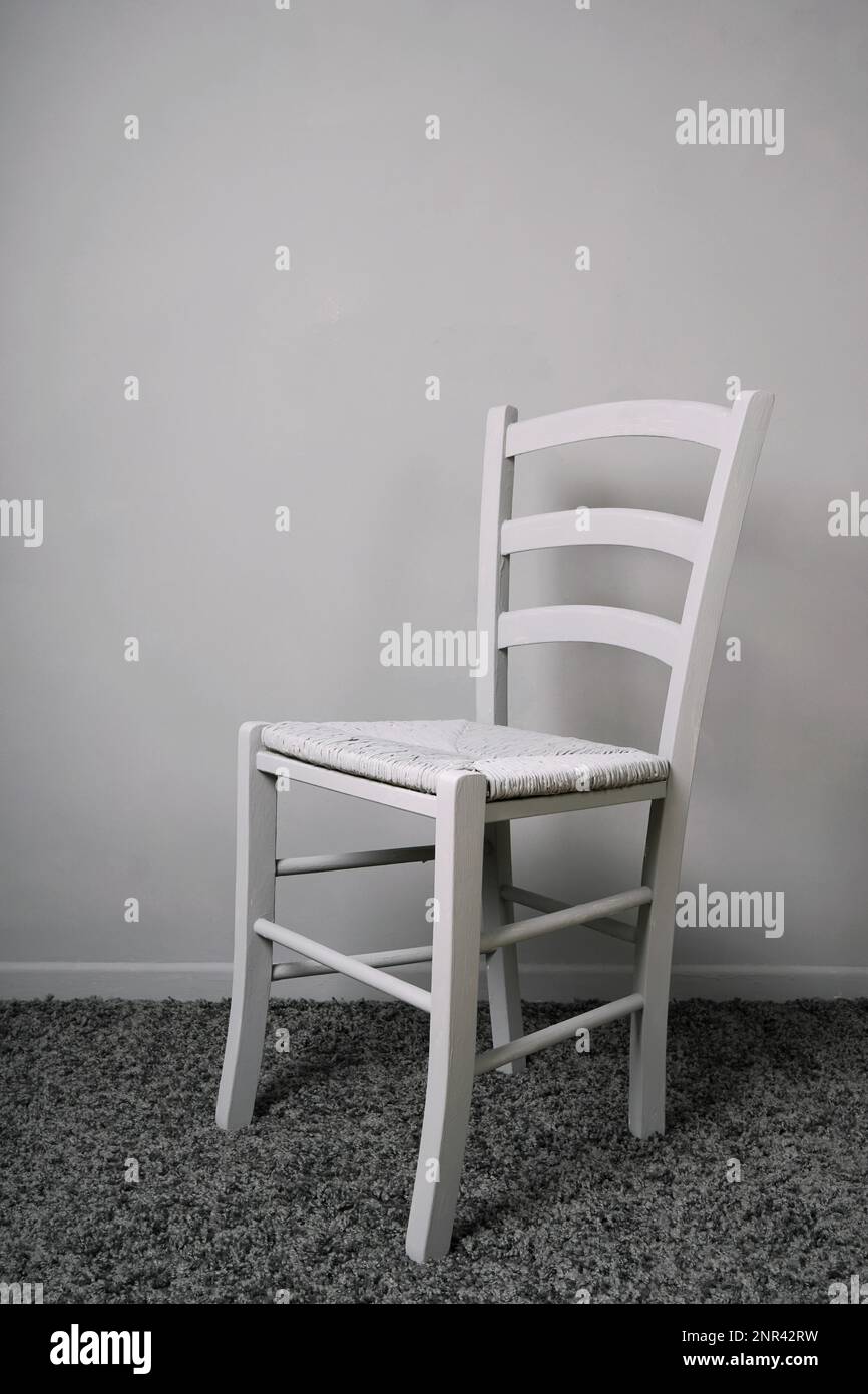 empty-vacant-chair-in-entirely-gray-room-stock-photo-alamy