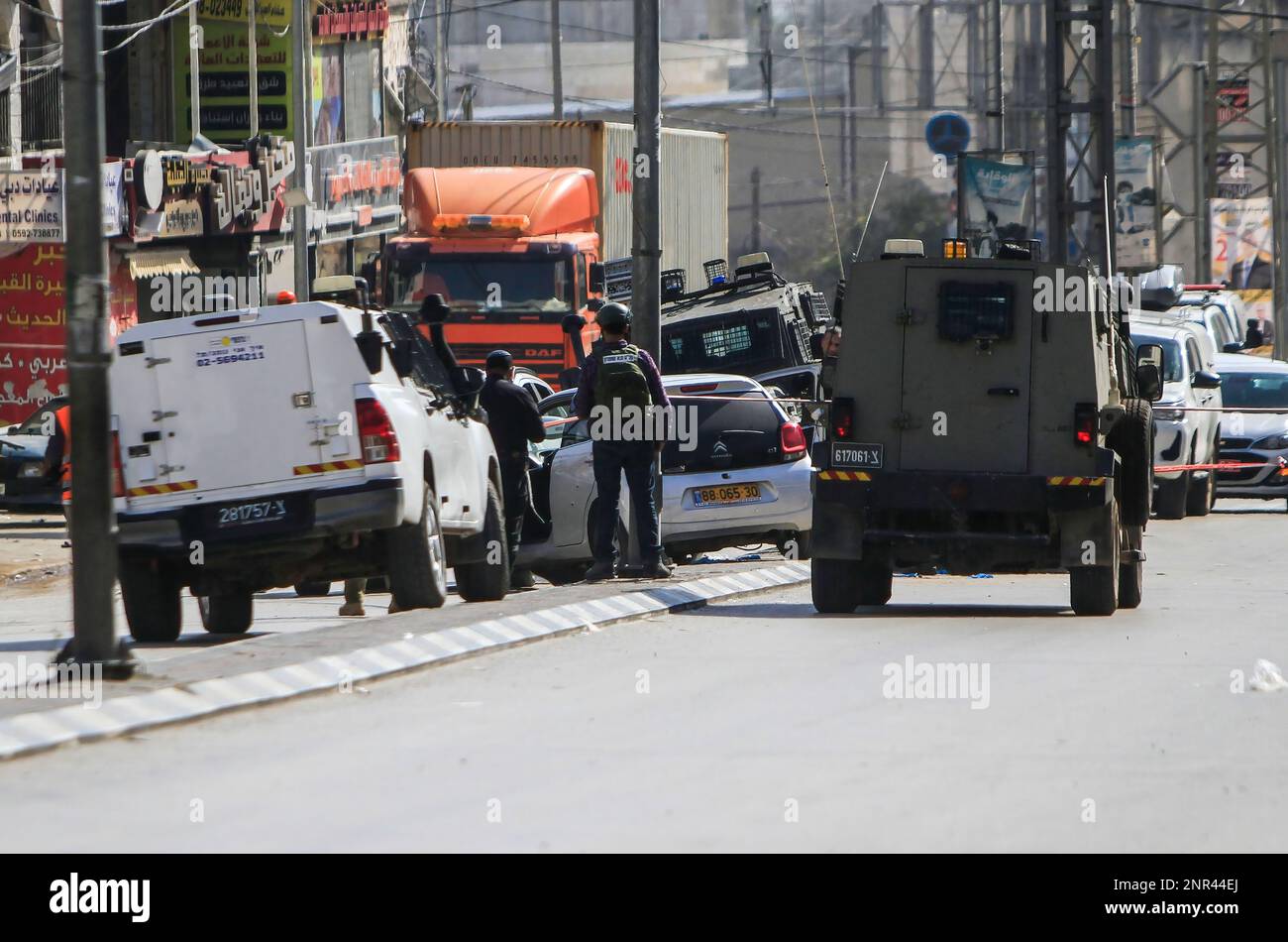 Nablus, Palestine. 26th Feb, 2023. Israeli soldiers transfer the car in  which two Israeli settlers were killed near the town of Hawara, south of  Nablus, in the occupied West Bank. A Palestinian