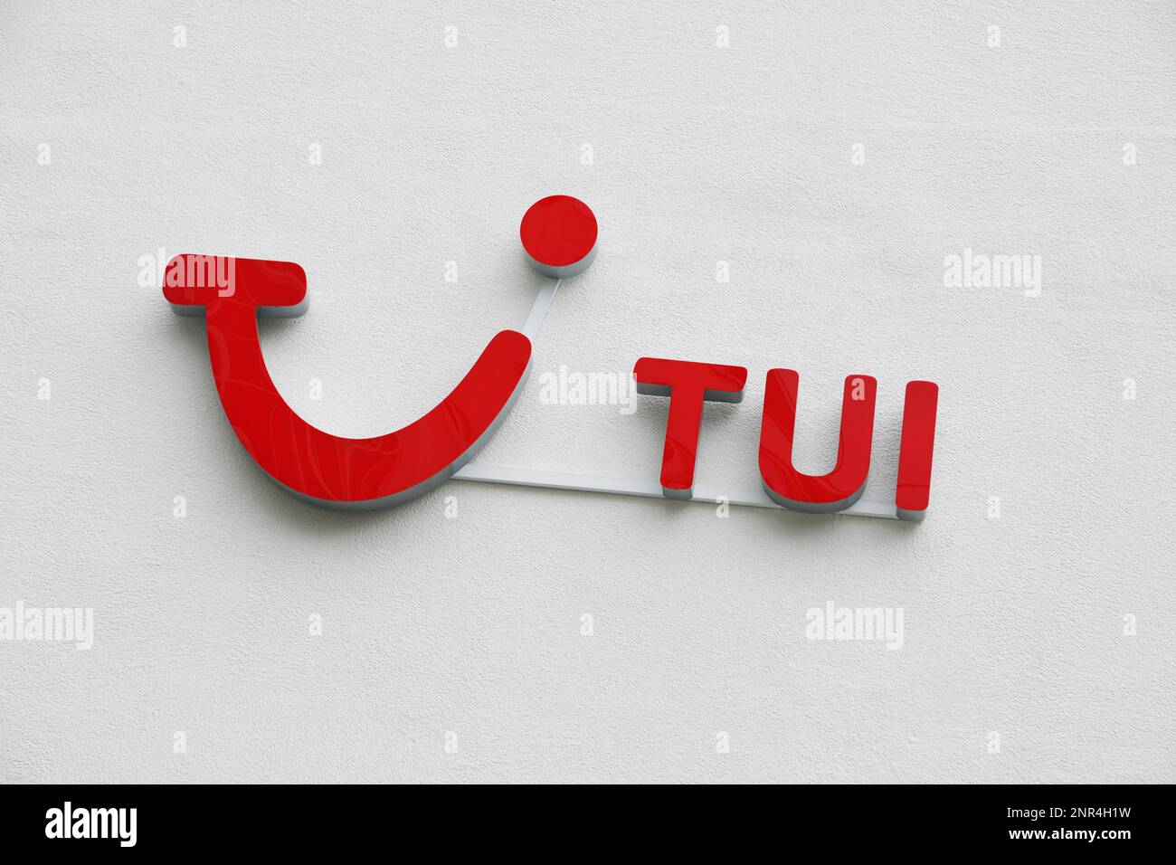 Hannover, Germany - June 6, 2018: TUI logo and brand sign on wall. TUI Group is the largest travel and tourism company in the world, headquartered in Stock Photo