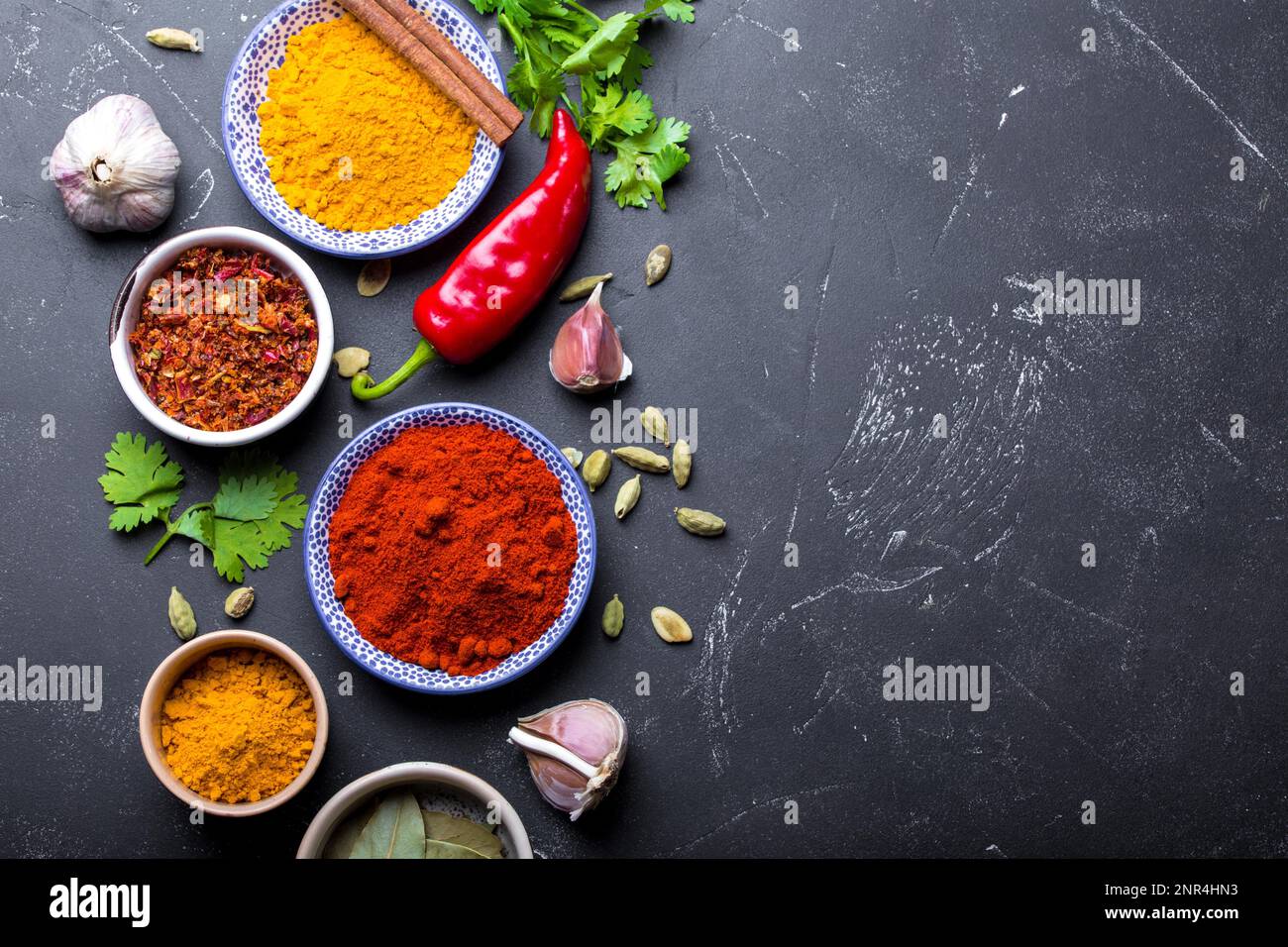 Set of Indian food cooking ingredients. Traditional Indian assorted spices and herbs. Curry