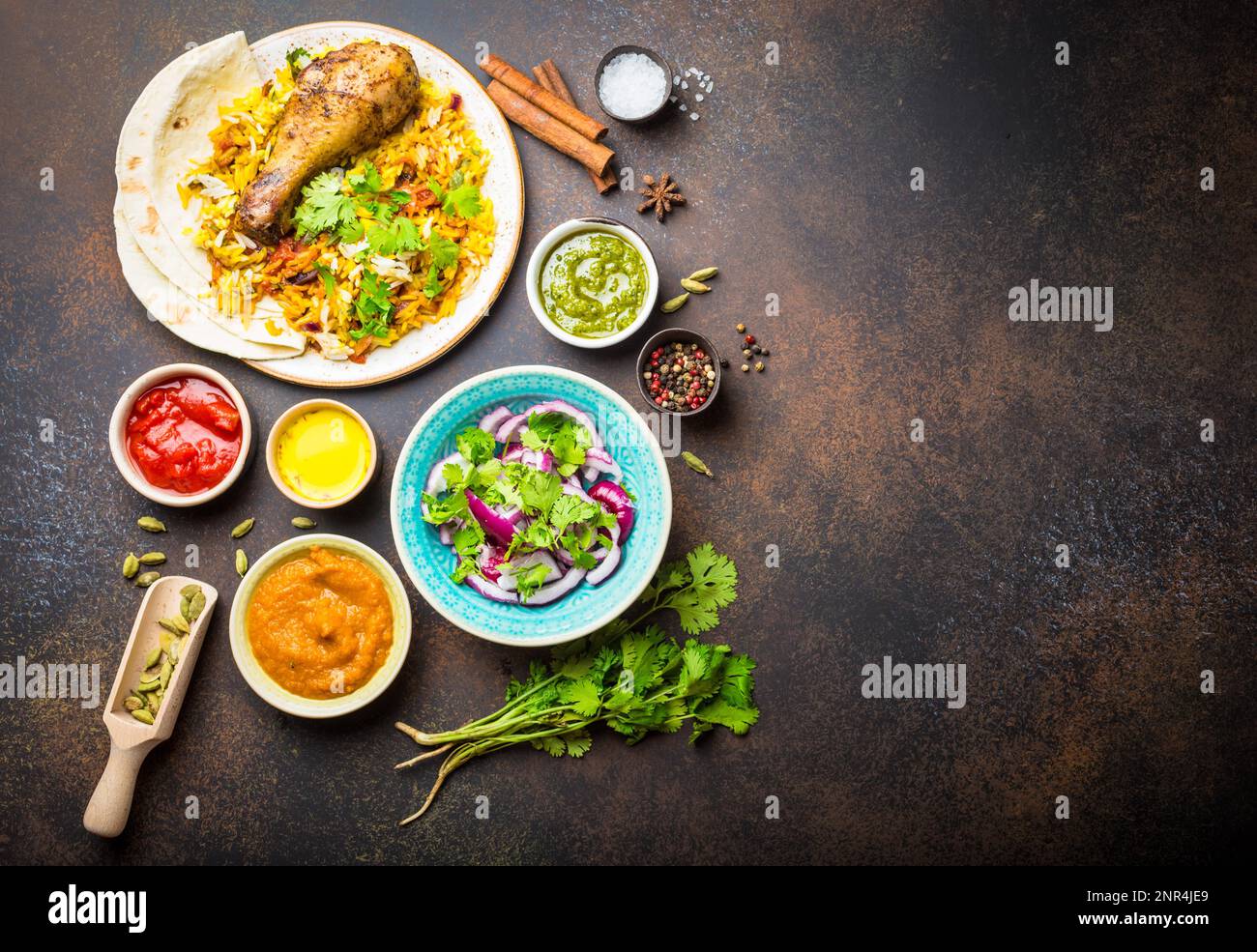 Assorted traditional Indian dishes, a top view of biryani chicken with