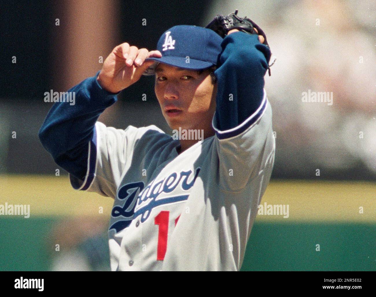 Dodgers Pitcher Hideo Nomo adjusts his cap in his MLB debut in San Francisco, California, Monday
