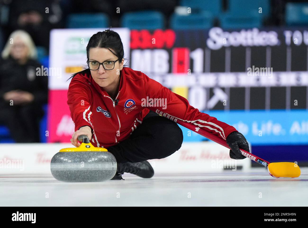 Team Canada skip Kerri Einarson delivers a rock while playing Manitoba
