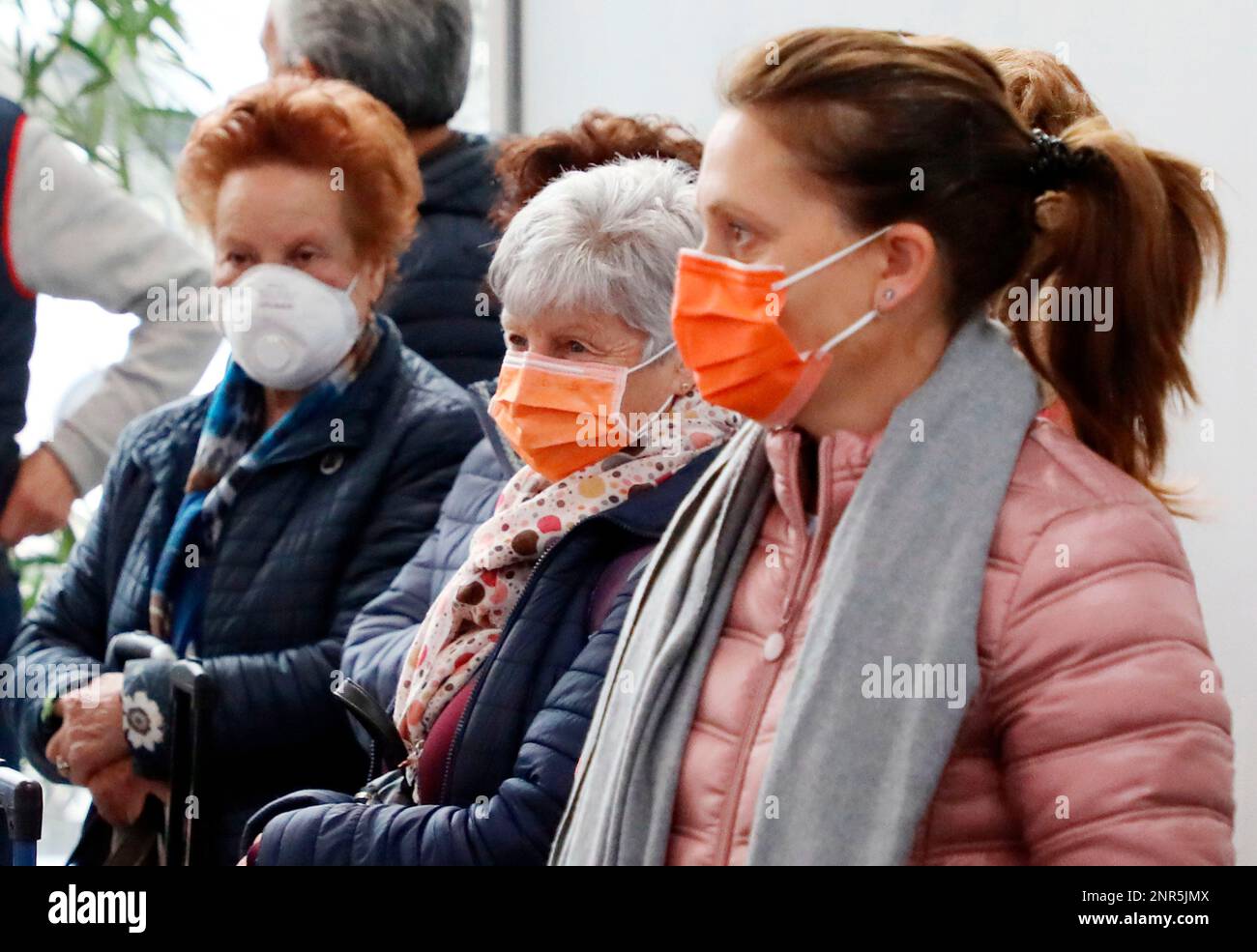 People wearing masks are seen at Athens International Airport in Athens