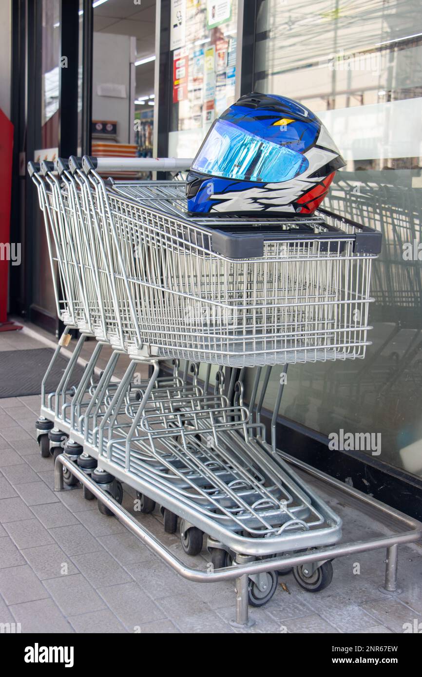 A shopping carts park in front of the supermarket entrance Stock Photo
