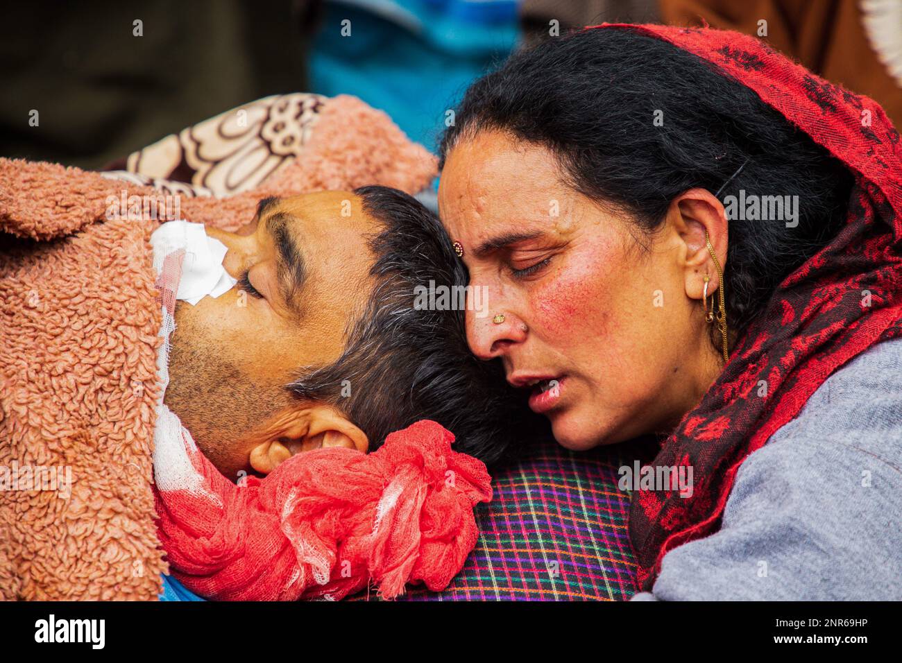 Srinagar, India. 25th Feb, 2023. (EDITOR'S NOTE: Image depicts death) A relative mourns near the dead body of Sanjay Sharma a Kashmiri Hindu bank security guard who was shot dead by suspected militants in Pulwama South of Indian administered Kashmir. Police said suspected militants opened fire on Sanjay Sharma while he was on his way to a local market in Achan village Pulwama district. Credit: SOPA Images Limited/Alamy Live News Stock Photo