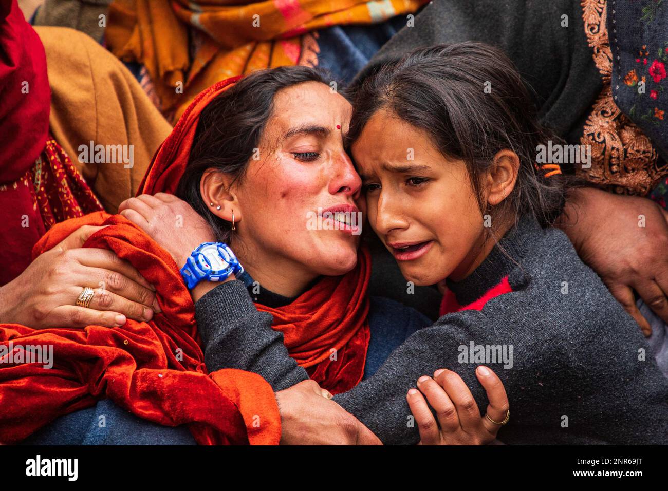 Srinagar, India. 25th Feb, 2023. Wife and daughter of Sanjay Sharma a Kashmiri Hindu bank security guard mourn during his funeral procession in Pulwama South of Indian administered Kashmir. Police said suspected militants opened fire on Sanjay Sharma while he was on his way to a local market in Achan village Pulwama district. Credit: SOPA Images Limited/Alamy Live News Stock Photo