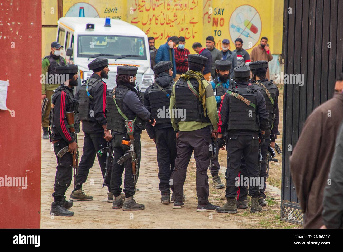 Srinagar, India. 25th Feb, 2023. Indian paramilitary troopers stand on guard at the attack site where Sanjay Sharma a Kashmiri Hindu bank security guard was shot dead by suspected militants in Pulwama South of Indian administered Kashmir. Police said suspected militants opened fire on Sanjay Sharma while he was on his way to a local market in Achan village Pulwama district. Credit: SOPA Images Limited/Alamy Live News Stock Photo