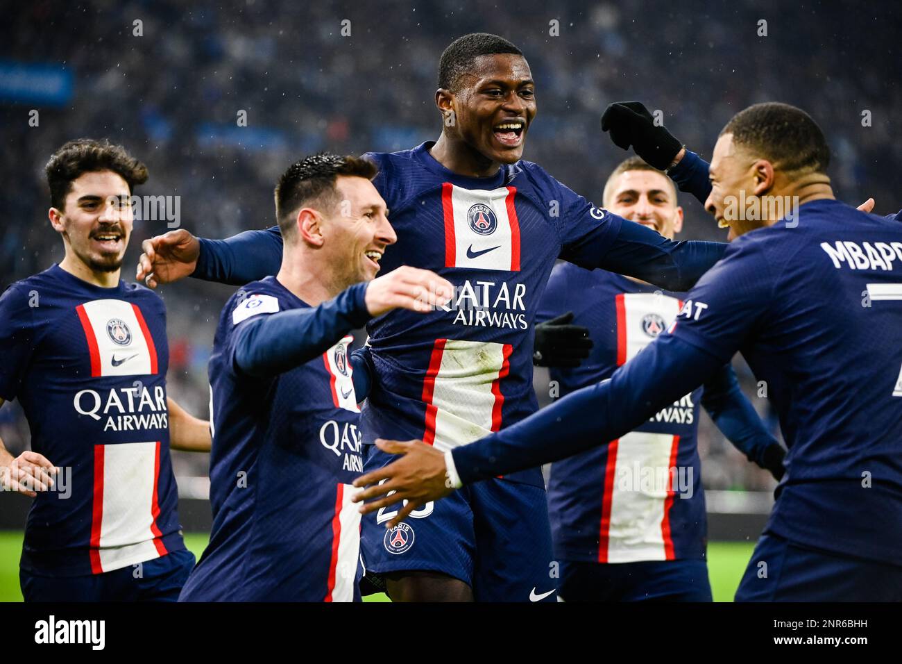 Marseille, France. 26th Feb, 2023. Paris Saint-Germain (PSG)'s Kylian Mbappe (1st R) and Lionel Messi (2nd L) celebrate their goal during a French Ligue 1 football match between Olympique de Marseille (OM) and Paris Saint-Germain (PSG) at the Velodrome stadium in Marseille, France, Feb. 26, 2023. Credit: Clement Mahoudeau/Xinhua/Alamy Live News Stock Photo