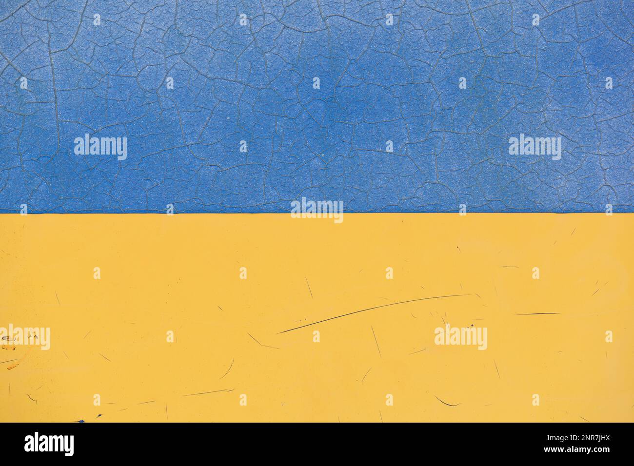 Ukraine flag with cracked texture. Blue and yellow background. Stock Photo