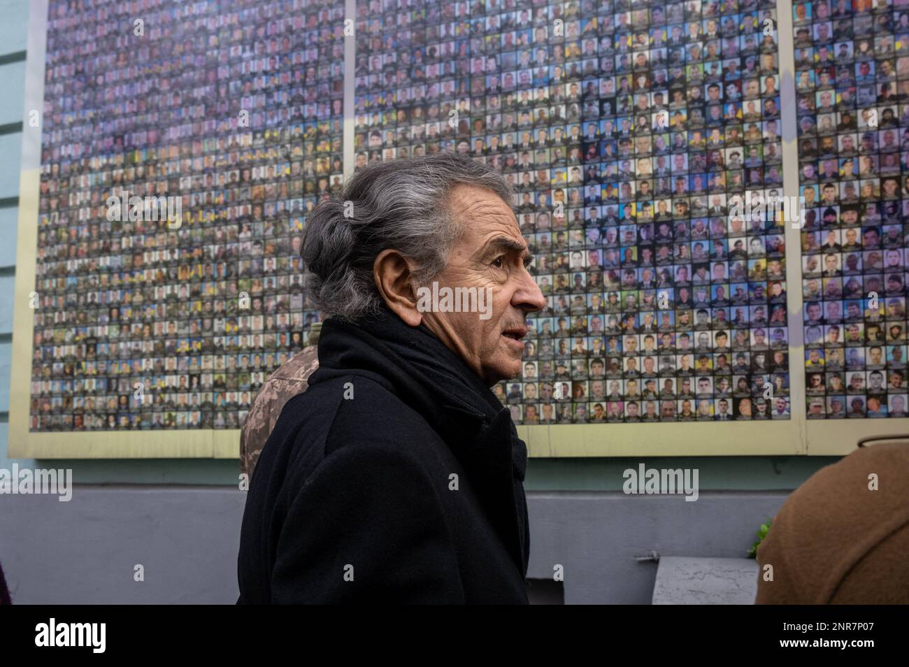 French public intellectual Bernard-Henri Levy (often referred to as BHL, center), looks at photos of Ukrainian army members killed by Russian army since 2014, on the wall of Ukraine’s National Military History Museum, in Kyiv, or Kiev, Ukraine, on February 26, 2023, Photo by Ammar Abd Rabbo/ABACAPRESS.COM Stock Photo