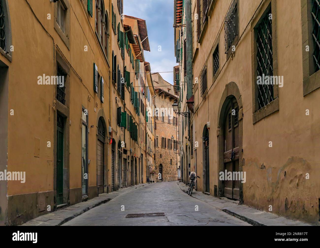 Medieval Renaissance gothic buildings along a narrow street in Oltrarno Santo Spirito area of Centro Storico or Historic Centre of Florence, Italy Stock Photo