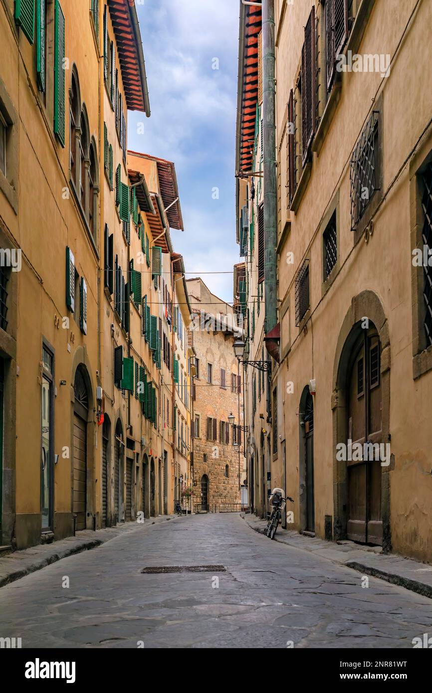 Medieval Renaissance gothic buildings along a narrow street in Oltrarno Santo Spirito area of Centro Storico or Historic Centre of Florence, Italy Stock Photo