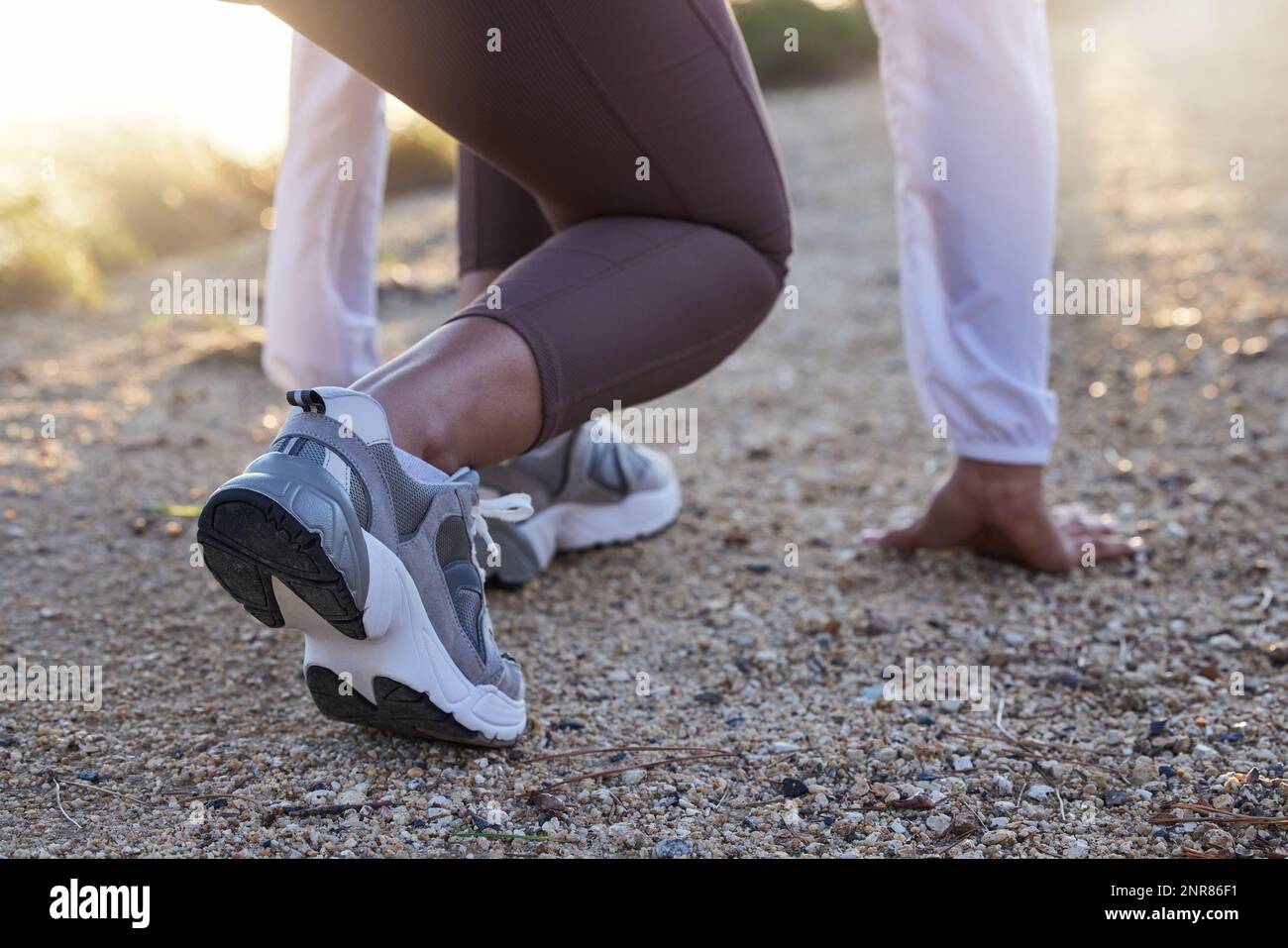Fitness, shoes or runner ready to start running workout, sports exercise or cardio training outdoors. Wellness, legs or healthy girl with commitment Stock Photo