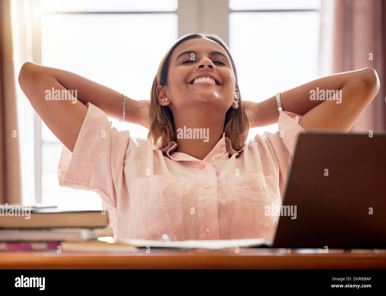 Relax, student and woman with eyes closed in home after studying and finishing research project. Resting, education scholarship or smile of happy and Stock Photo