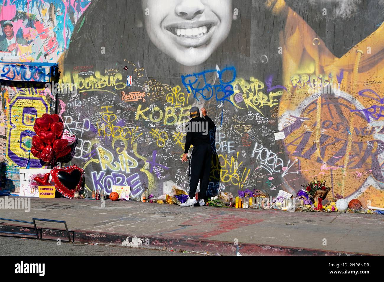 General overall view of Kobe Bryant memorial mural at Sparadise La Brea at 1251 St. La Brea Ave., Sunday, Feb 16, 2020, in Los Angeles. The mural, created street artist Thierry Guetta aka Mr. Brainwash, showcases Bryant and his daughter Gigi Bryant (Gianna Bryant), with the former basketball player wearing a Lakers sweatshirt against a colorful background and newspaper images of Bryant during his NBA years, on the front. There is another image of Bryant in his purple Lakers uniform with a quote of his written next to him on the side of the building. This mural also pays tribute to the other se Stock Photo
