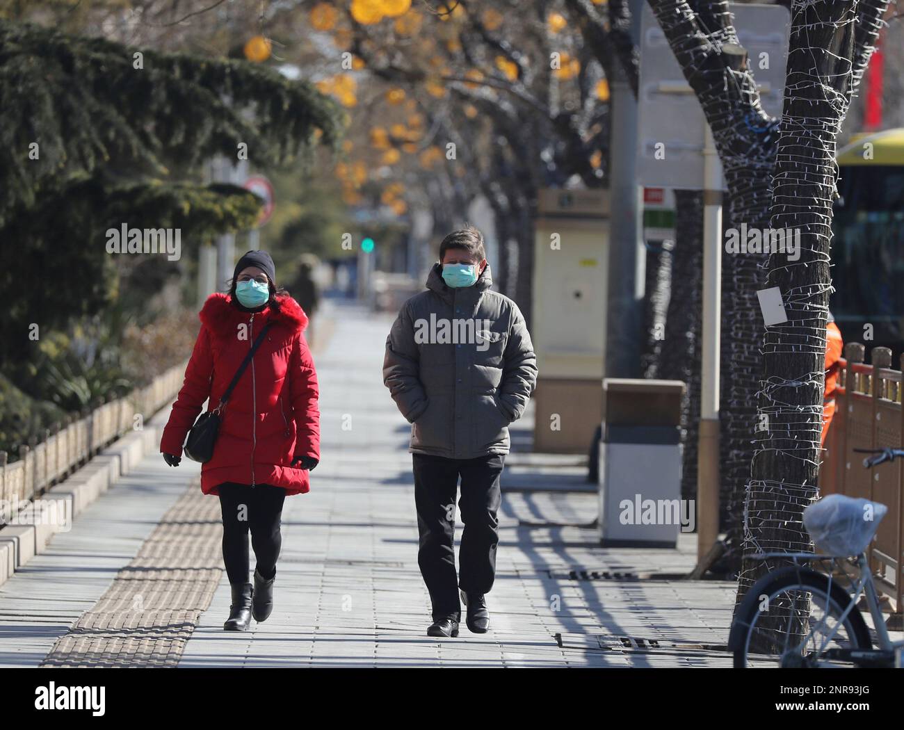 People wear a mask in Beijing, China on Feb 16, 2020. The number of the new  coronavirus COVID-19-hit patients has reached to 68,500 and the death toll  has been confirmed 1,665 so