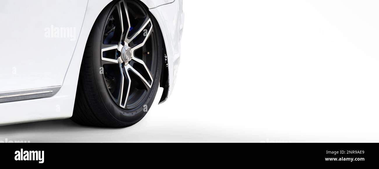 White sports car coupe parked on a white background, panoramic banner with copy space. Stock Photo