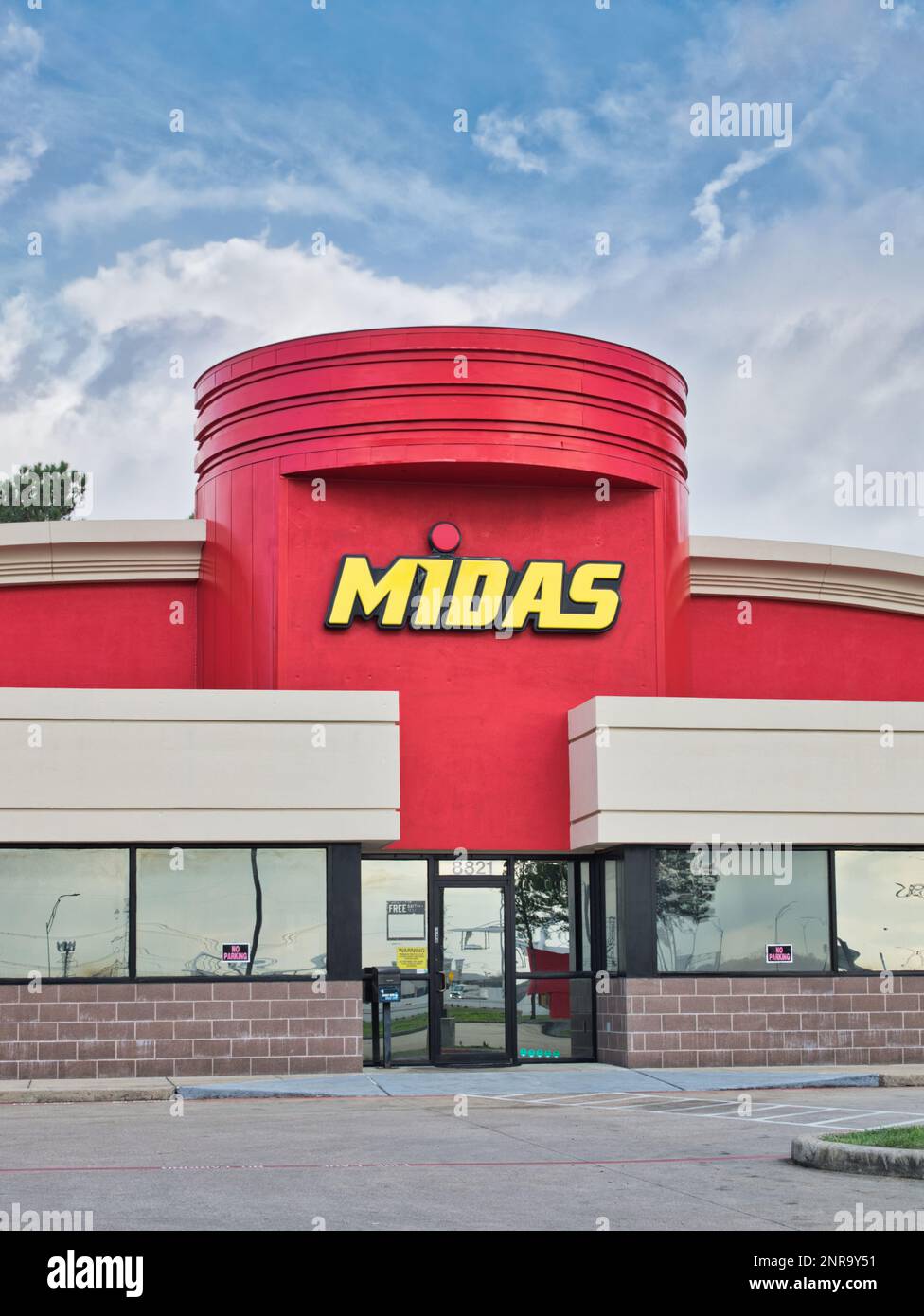 Houston, Texas USA 02-26-2023: Midas business storefront exterior in Houston, TX. Automotive service chain founded in 1956. Stock Photo