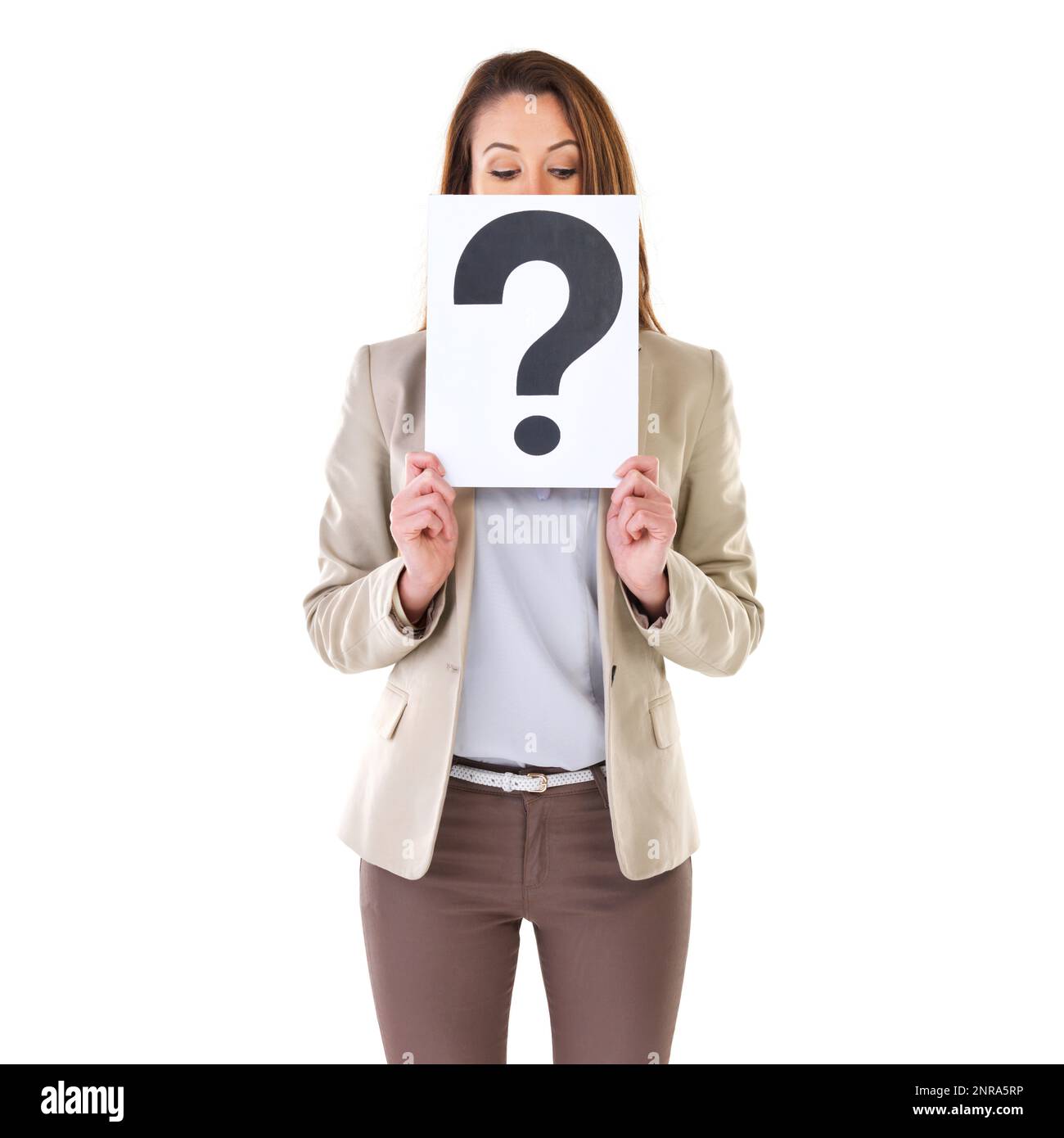 Curious So am I. Studio shot of a young businesswoman holding a placard with a question mark on it. Stock Photo