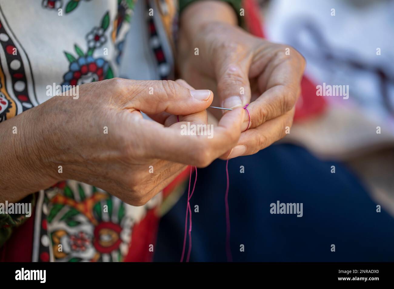 woman hand and white thread crochet Stock Photo