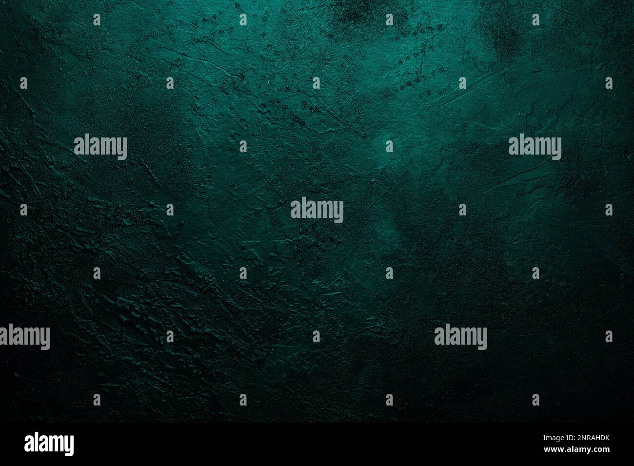 Deep emerald green texture or background with stains, waves and grain elements. Image with place