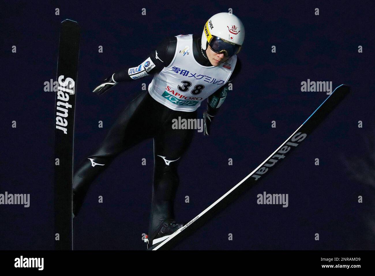 Japan's Yukiya Sato soars through the air to win the individual ski ...