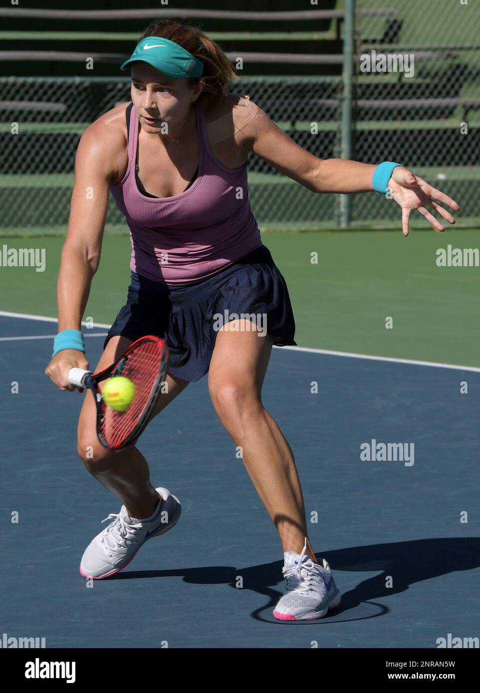 NEWPORT BEACH, CA - FEBRUARY 01: WTA tennis player Stefanie Voegele (SUI)  returns a shot in a semifinals match played during the Oracle Challenger  Series tennis tournament played on February 1, 2020