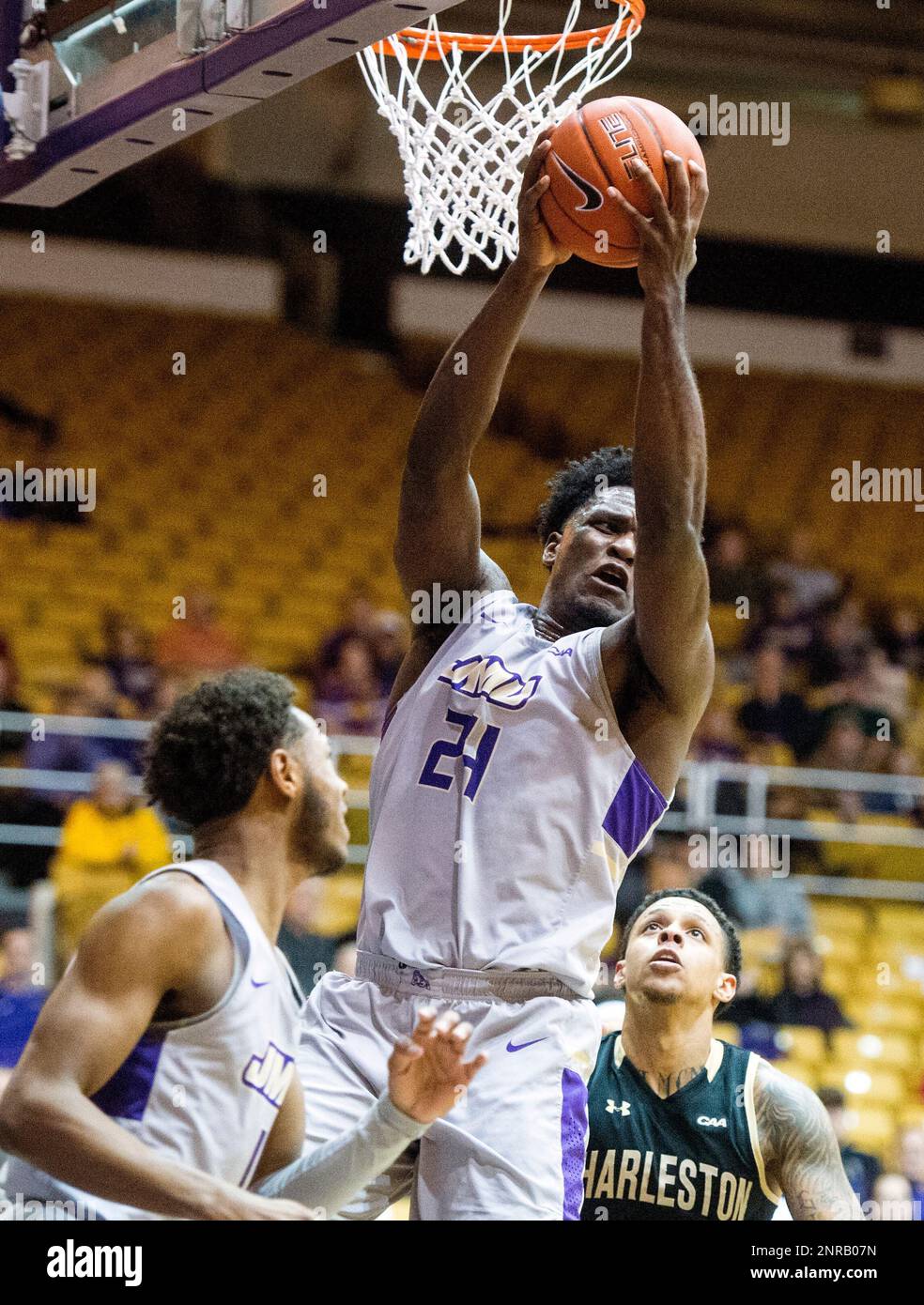 James Madison forward Dwight Wilson (24) pulls down a rebound during