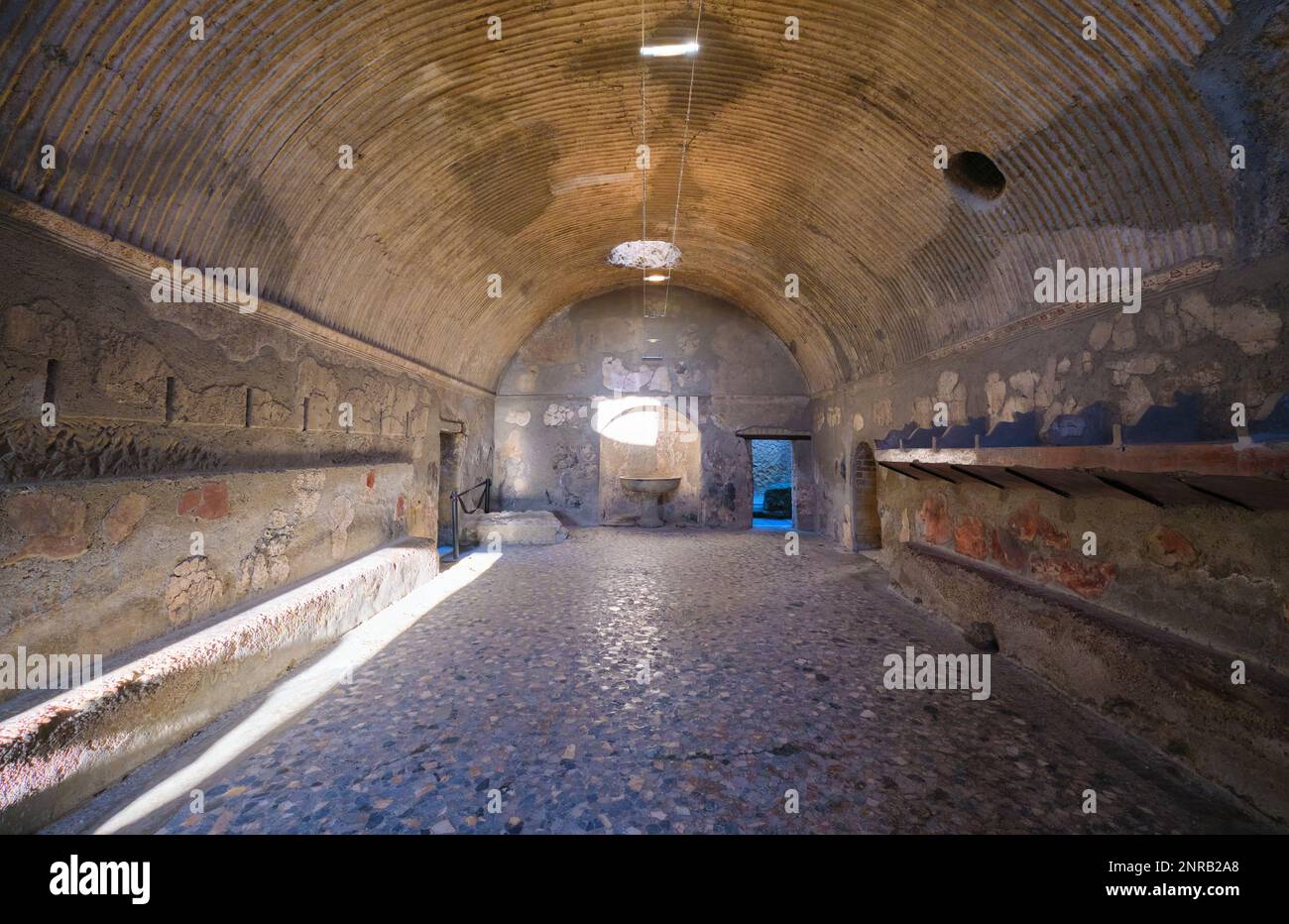 View of the arched room for bathing, washing, steam. At the Terme Maschili baths of the Roman ruin archeological town, city site of Herculaneum, near Stock Photo