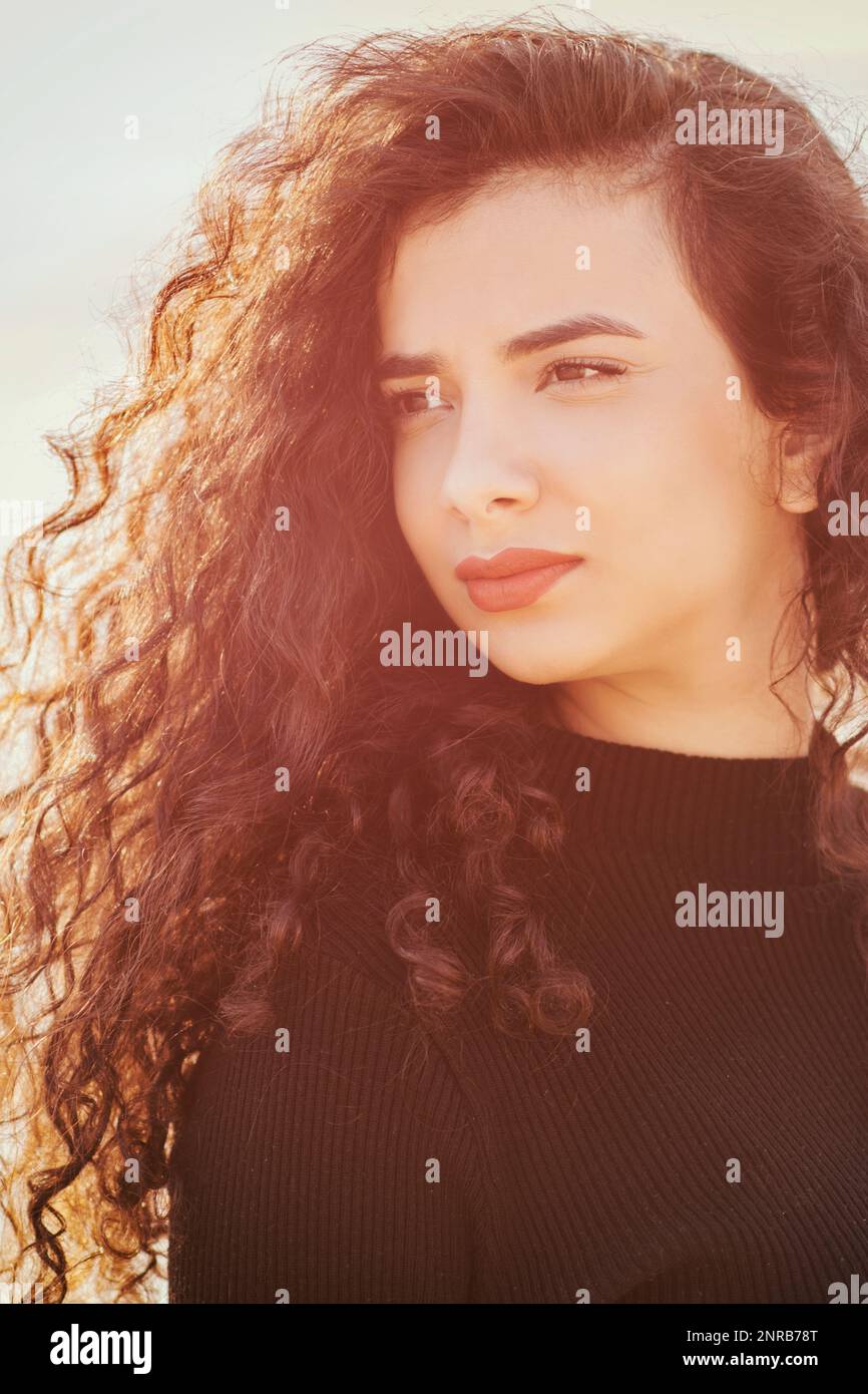 Hispanic young woman long curly hi-res stock photography and images - Alamy
