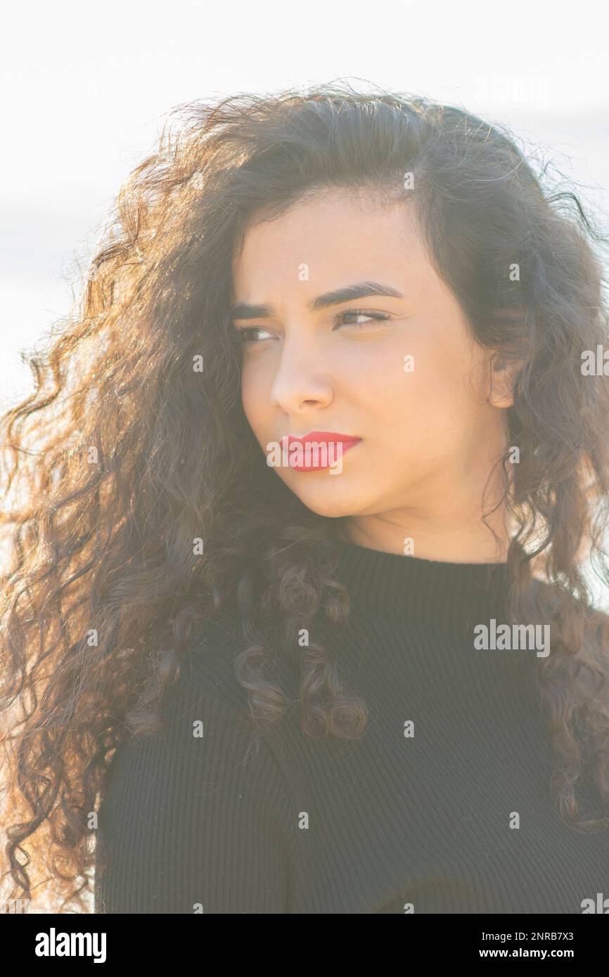 Hispanic young woman long curly hi-res stock photography and images - Alamy