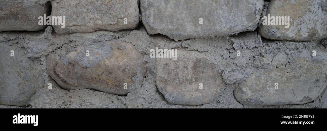 Old castle stone wall texture background. Finishing the facade with ...