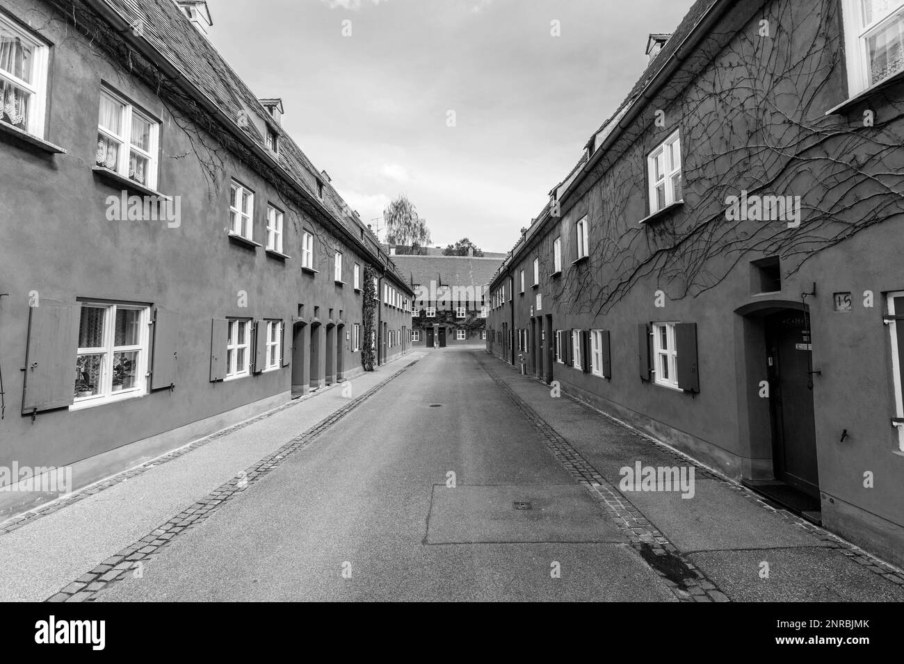 AUGSBURG, GERMANY - APRIL 29, 2015: The Fuggerei is the worlds oldest social housing complex still in use in Augsburg, Germany. Stock Photo