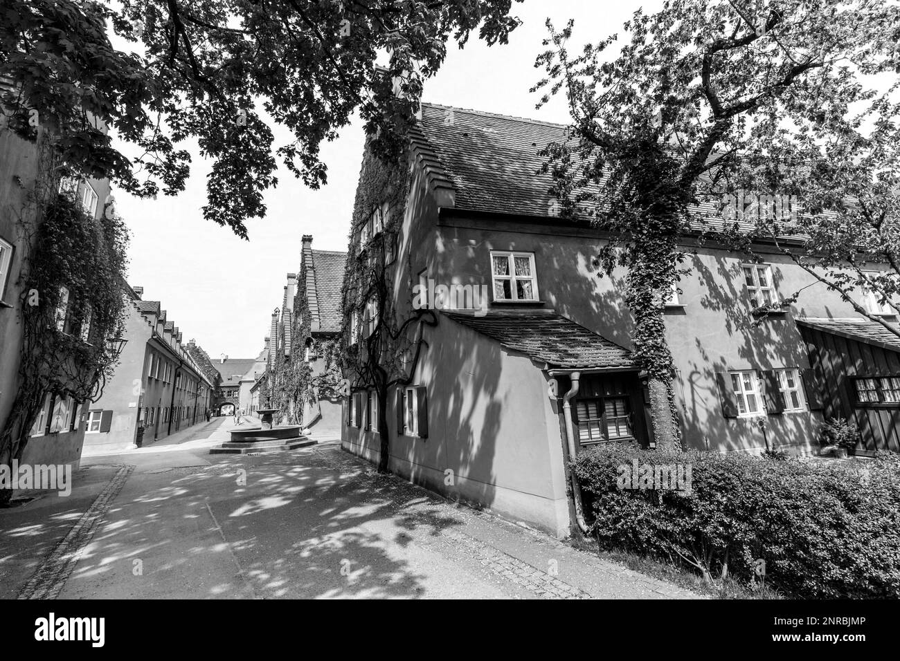AUGSBURG, GERMANY - APRIL 29, 2015: The Fuggerei is the worlds oldest social housing complex still in use in Augsburg, Germany. Stock Photo