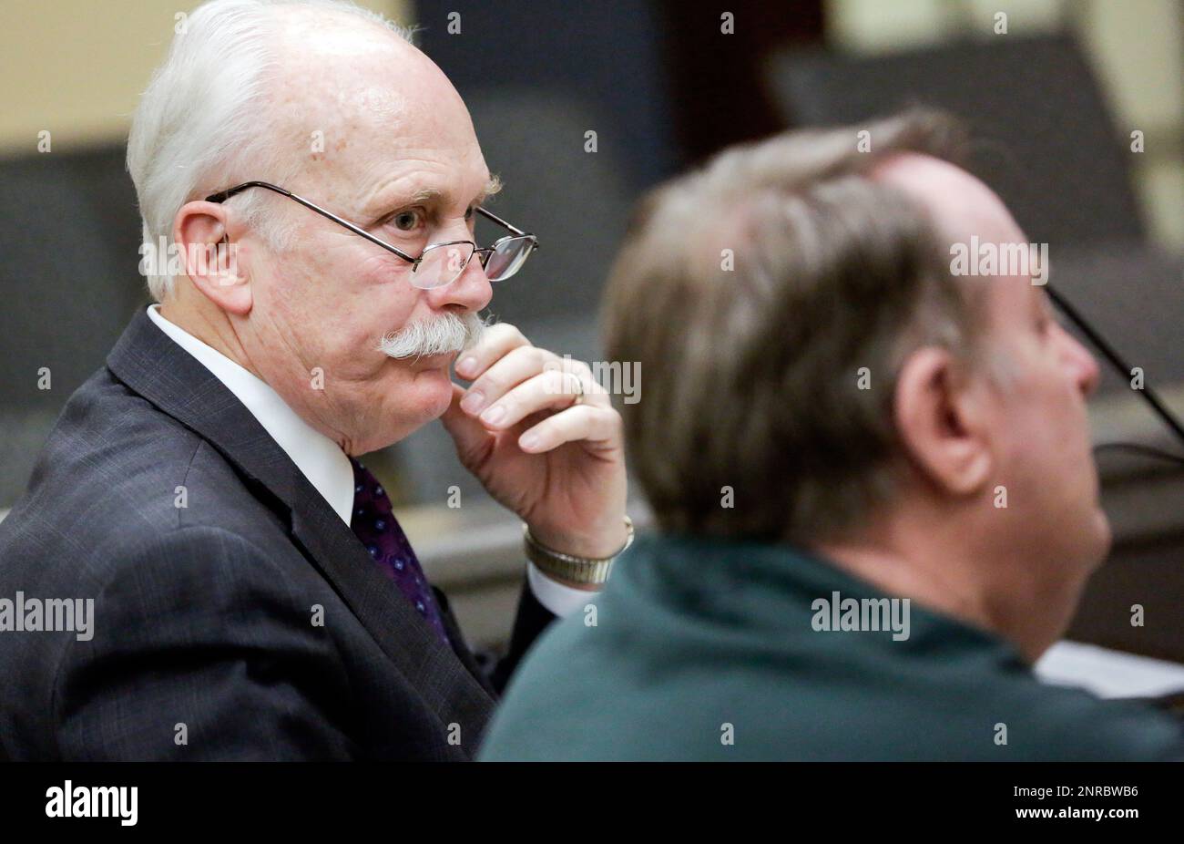 defense-attorney-leon-spies-left-sits-with-jerry-burns-during-a