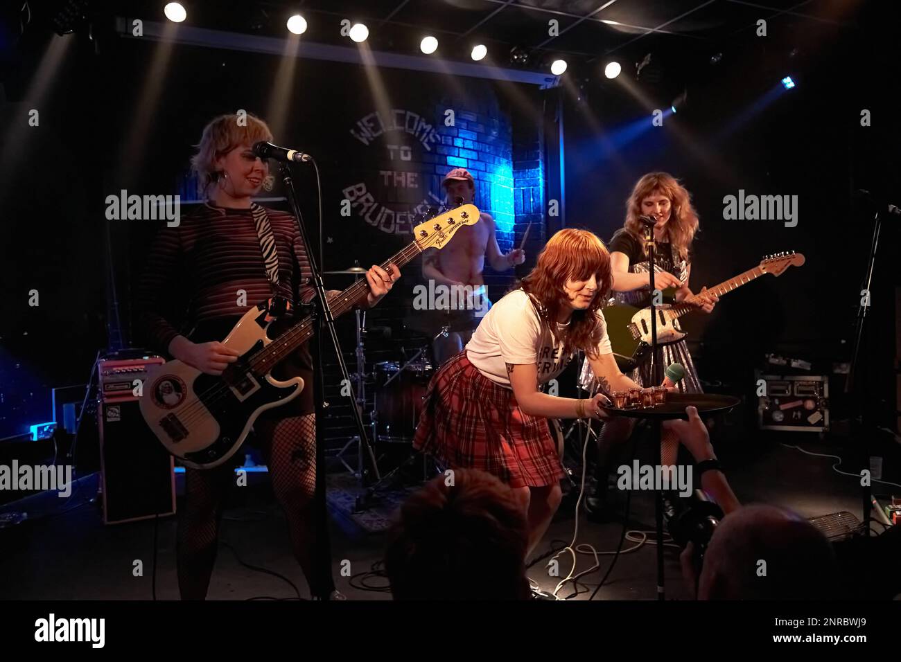 Punk band Panic Shack are handed Tequila shots from fans on stage