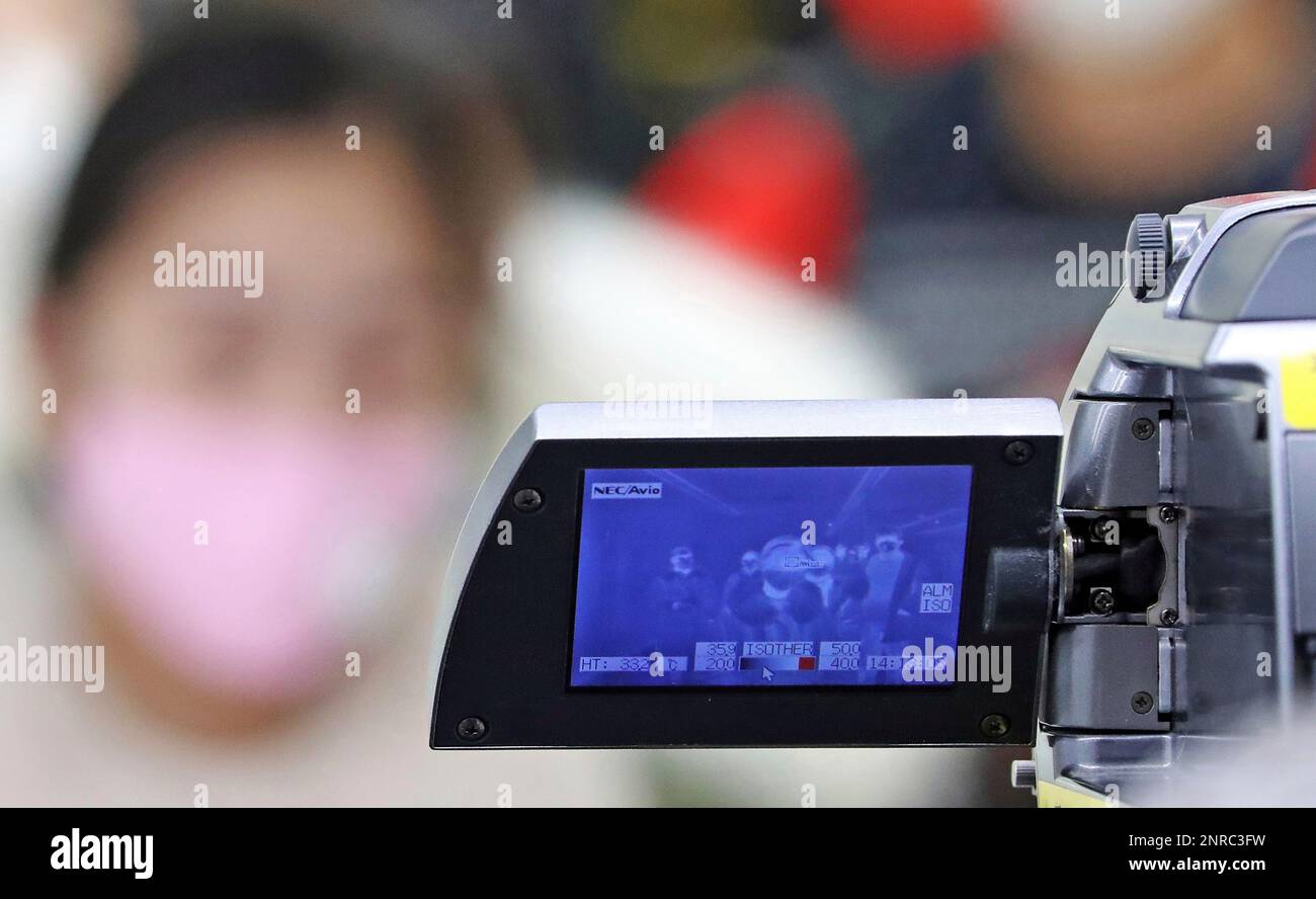 Passengers wearing mask pass at quarantine inspection during the time