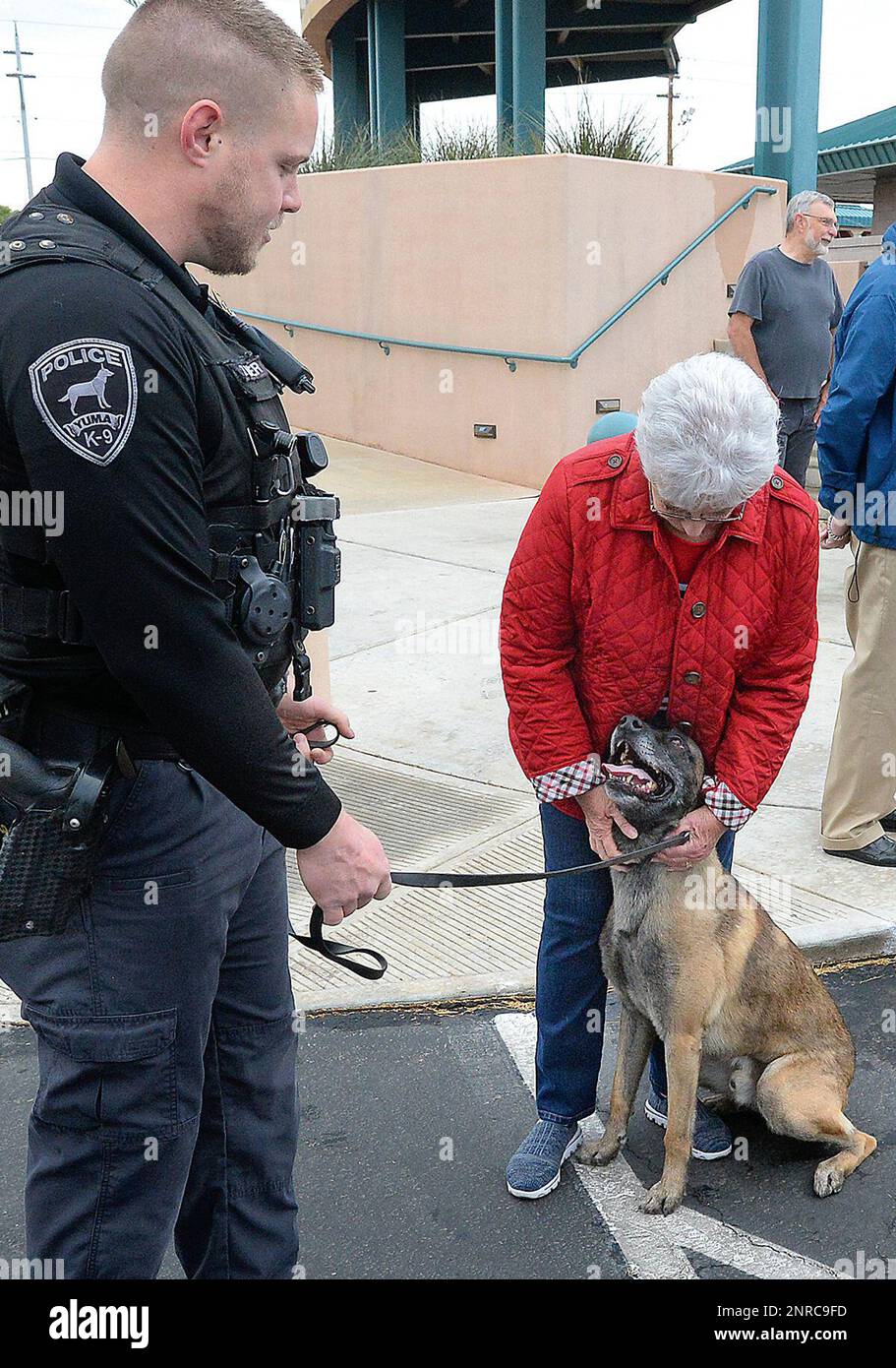 Police K9 Randy Country Roads RV Village resident Sherri Wylie, right, gives Yuma ...
