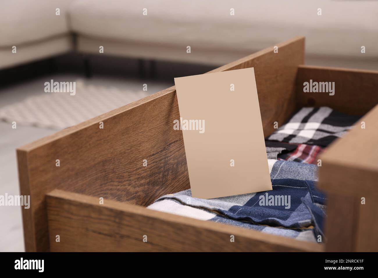 Scented sachet and folded clothes in drawer Stock Photo Alamy
