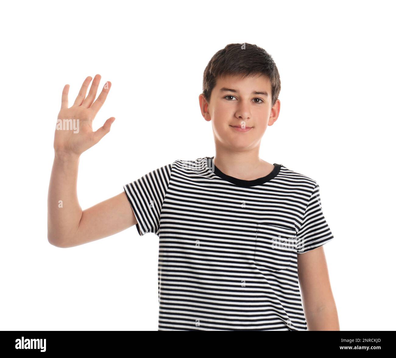 Happy Teenage Boy Waving To Say Hello On White Background Stock Photo happy-teenage-boy-waving-to-say-hello-on-white-background-stock-photo