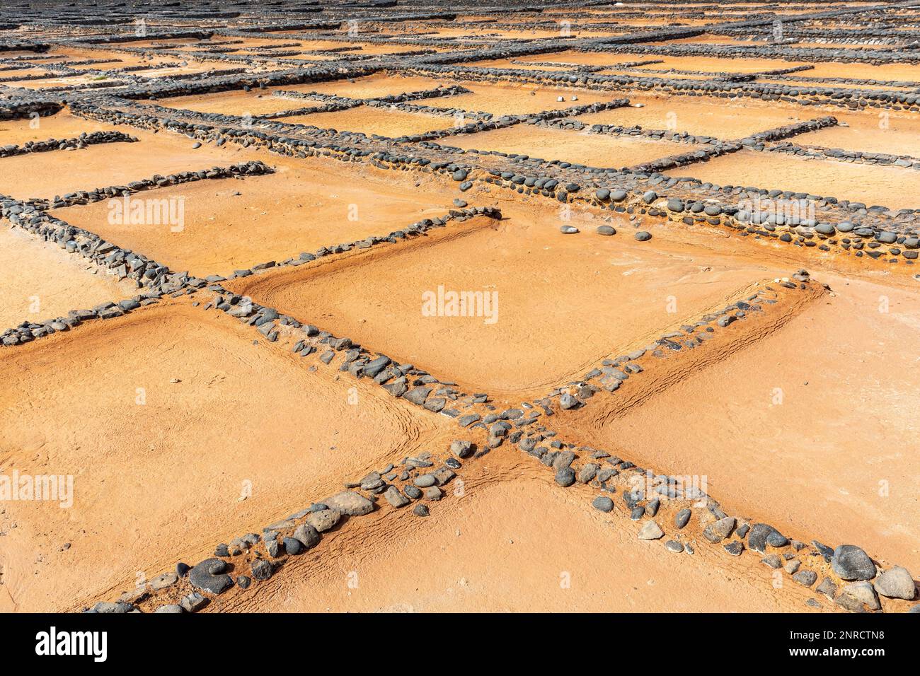 Evaporation pans dried up for maintenance at the salt museum in Fuerteventura. Stock Photo