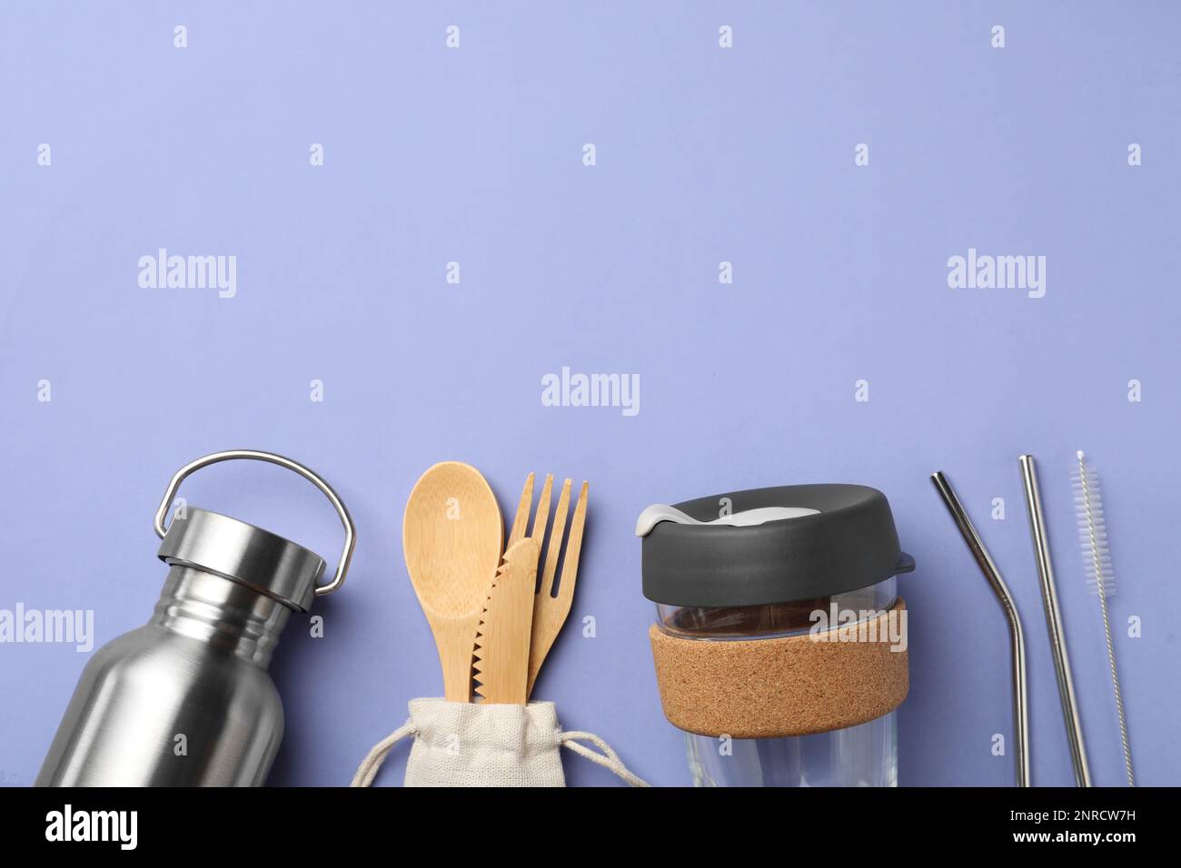 Flat lay composition with eco friendly products on lavender background ...
